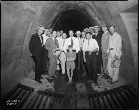 men standing in tunnel 2